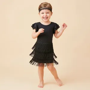 Close-up of a black hollow lace headband with embroidered flowers on a toddler girl