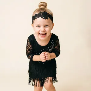 Close-up of a child wearing a black floral lace headband for Latin dance