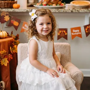 Children's white fabric bow hair clip with Thanksgiving pumpkin embroidery detail