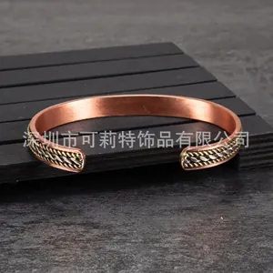 Adjustable magnetic red copper cuff bracelet with braided twisted pattern details 8mm