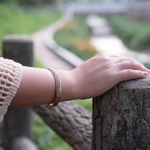 Handmade woven red copper magnetic bracelet with a stylish adjustable open design