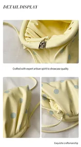 Detailed macro views showing the zipper and pleated texture of yellow polka dot bag