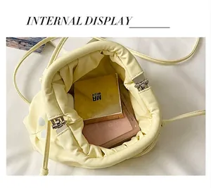 Internal view of a stylish pleated dumpling bag featuring polka dot pattern for women