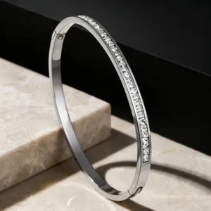 Elegant silver titanium steel bangle with full row of sparkling cubic zirconia stones.