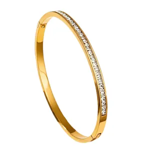 Elegant gold stainless steel bangle bracelet with sparkling diamond inlay for women