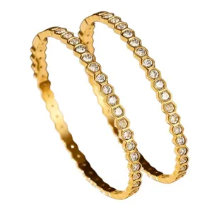 Geometric hexagonal diamond-encrusted bracelet in 18K gold plated stainless steel.