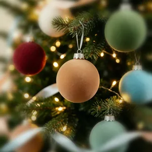 Elegant flocked velvet Christmas ball ornaments displayed on a decorated pine tree