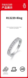 Elegant 925 sterling silver band ring with multiple sparkling moissanite stones.