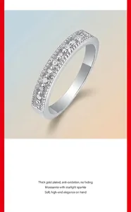 Detailed close-up of a silver moissanite eternity band ring with a sparkling finish