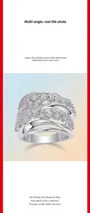 Detail shot of wide crisscross S925 sterling silver ring with sparkling moissanite stones.