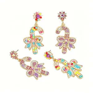 Colorful Christmas candy cane drop earrings with rhinestones and bow detail