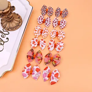 Collection de barrettes à nœuds imprimées sur le thème de l'automne, motifs citrouille et léopard.