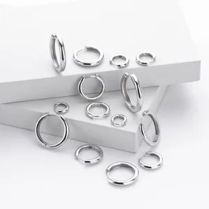 Set of S925 sterling silver hoop earrings in various sizes on white display blocks