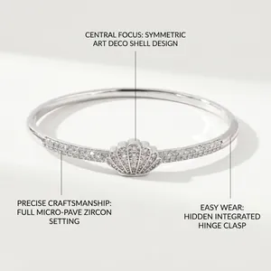 Detail of silver shell bangle featuring micro-pave zircons and a hidden hinge clasp design