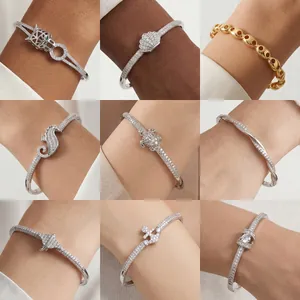 Detailed display of assorted cubic zirconia bangles with animal and nautical charms