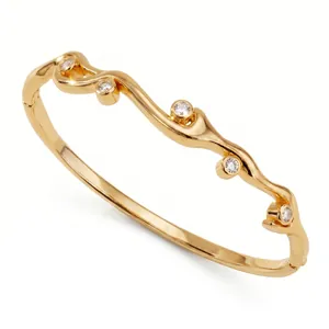 Élégant bracelet jonc en cuivre plaqué or 18 carats avec cinq zircons clairs sertis