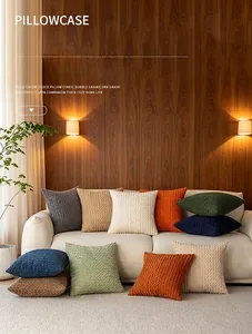 Cozy lifestyle scene showing various textured bubble grain pillowcases on a cream sofa