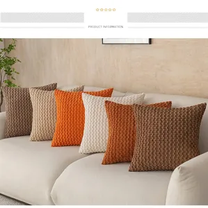 Six colorful textured bubble grain throw pillows arranged neatly on a modern beige sofa.