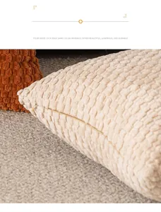 Detailed view of the invisible zipper and bubble texture on a cream decorative pillowcase