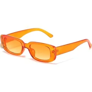 Detailed view of trendy orange rectangular sunglasses with translucent plastic frame