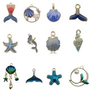 Collection of twelve ocean-themed enamel alloy pendants featuring mermaids and shells
