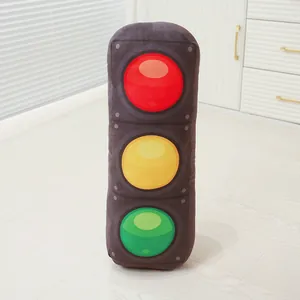 Detailed view of the soft traffic light plush pillow with red, yellow, and green lights