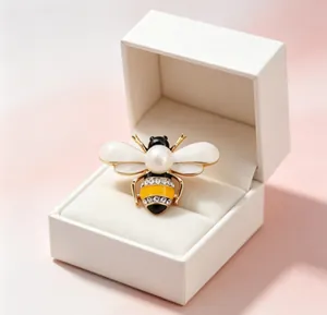 Elegant bee brooch with pearl and crystals presented in a white gift box