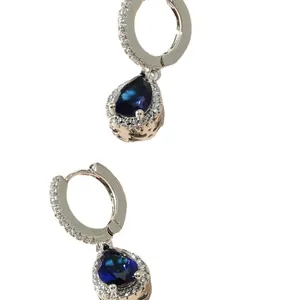 Elegant silver hoop earrings with teardrop blue sapphire crystal and diamond halo