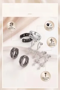 Detailed view of men's hip-hop cross earrings with zirconia and dragon patterns