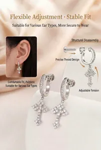 Detailed view of silver cross earrings with cubic zircon pavé and adjustable screw design