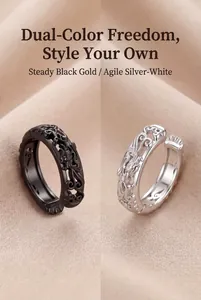 Detailed macro view of vintage dragon carved ear cuffs in black and silver metal finishes