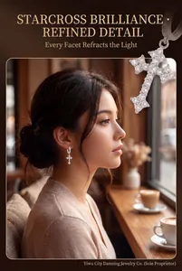 Close-up of elegant zircon cross earrings worn by a model in a cozy cafe setting.