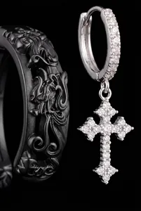Macro detail of a sparkling zirconia cross dangle earring in a hip-hop fashion style
