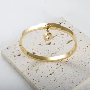 Elegant 18K gold plated Roman numeral bangle bracelet with crystal charm pendant
