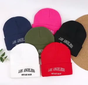 Detailed view of six colorful knit beanies with vintage style Los Angeless embroidery