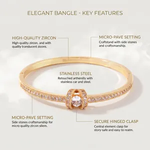 Elegante bracciale rigido in acciaio dorato con zirconi micro-pavé e pietra tonda
