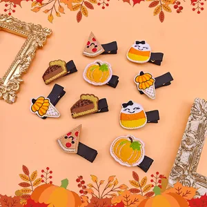 Kids embroidered Thanksgiving hair clips with pumpkin and pie designs for girls.