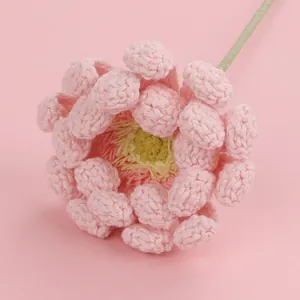 Delicate hand-crocheted pink yarn flower, ideal for romantic gifts and home decoration