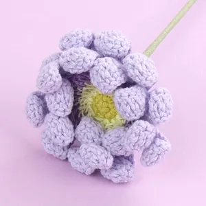 Exquisite handmade purple crocheted flower with yellow center and green stem for gifts
