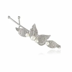 Close-up of elegant silver leaf hair clip with four white pearls on white background