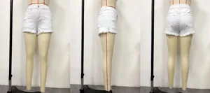Three-view detail of white low-waist denim shorts with distressed frayed hems