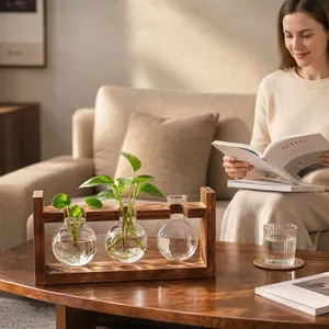 Cozy home setting with three bulb glass vases in a vintage wooden stand on a table