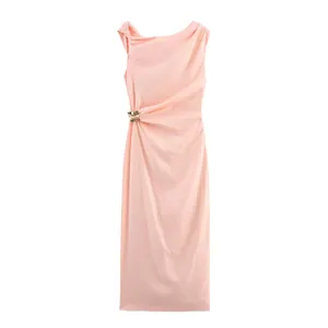 Peach asymmetrical midi dress with elegant gold buckle accent and sleeveless design