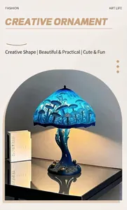 Enchanting magic mushroom LED desk lamp with artistic blue patterned shade and resin base