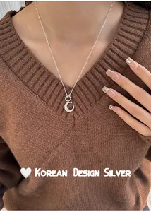 Detail shot of s925 silver crescent moon necklace with stylish OT toggle clasp