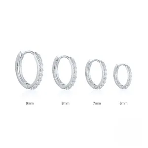 Size comparison of 6mm to 9mm silver hoop earrings with pavé shimmering cubic zirconia stones.