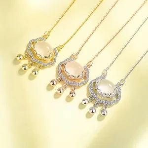 Detailed view of three S925 silver lock pendants in gold, rose gold, and silver colors