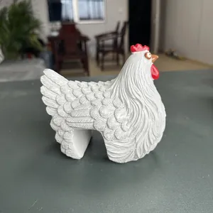 Detailed macro view of a white artistic resin hen figurine for garden fence decor