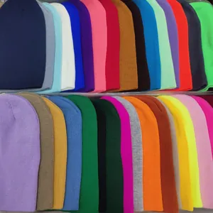 Detailed display of colorful knitted beanies in various candy colors for winter warmth