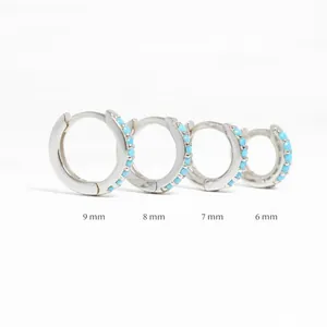 Set of four sterling silver hoop earrings with blue stones available in 6mm to 9mm sizes